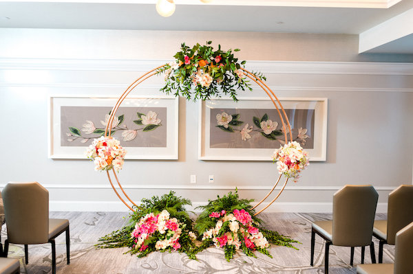 E'MAGNE Events & Co - North Carolina luxury wedding planner - branded logo - orange and navy blue wedding - moon gate - wedding ceremony structure
