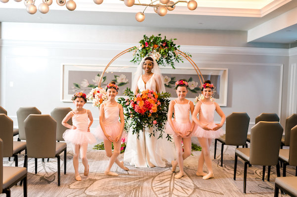 E'MAGNE Events & Co - North Carolina luxury wedding planner - branded logo - orange and navy blue wedding - bride with flower girls