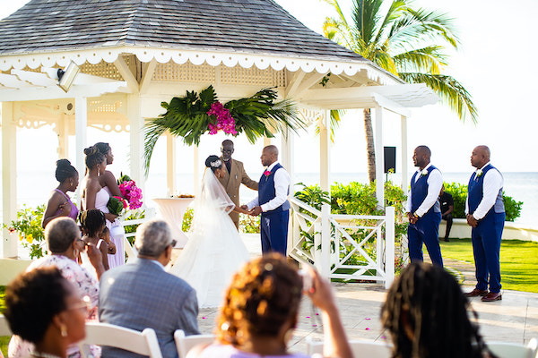 North Carolina destination wedding planner- Jamaican destination wedding - Moon Palace Jamaica- wedding gazebo - bride and groom exchanging wedding vows
