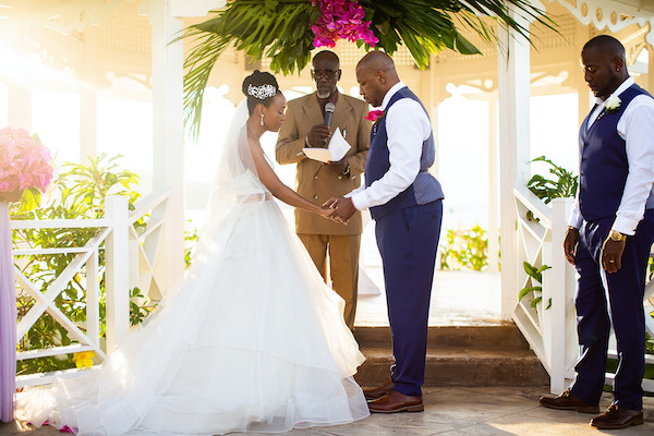 North Carolina destination wedding planner- Jamaican destination wedding - Moon Palace Jamaica- wedding gazebo - bride and groom exchanging wedding vows