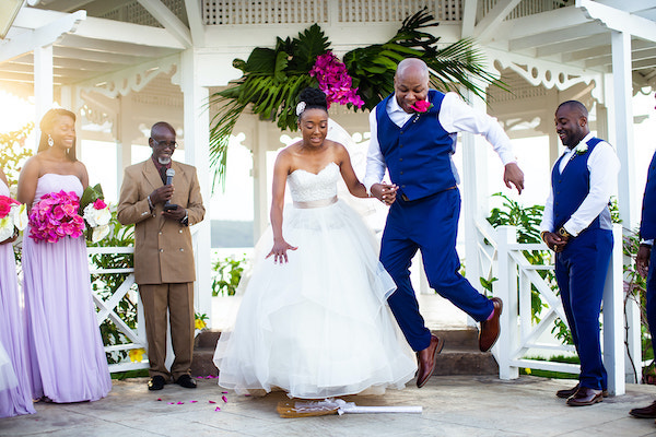 North Carolina destination wedding planner- Jamaican destination wedding - Moon Palace Jamaica- wedding gazebo - bride and groom - jumping the broom  - bride and groom jumping the broom