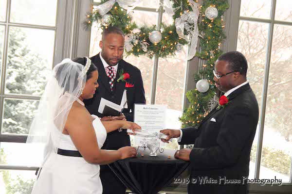 bride and groom exchanging wedding vows - black bride and groom exchanging wedding vows - winter wedding 