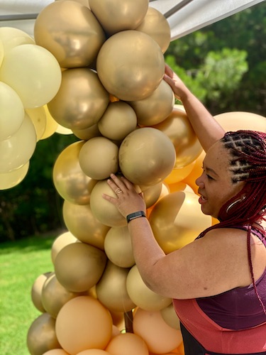 North Carolina balloon decor - balloon art for events - Shaunda working on a balloon creation - Shaunda Eggleston - E'MAGINE Events & Co